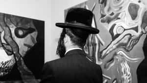 Man With Unorthodox Paintings Wallpaper