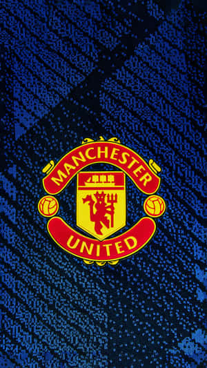 Manchester United Team Logo On Blue Wallpaper