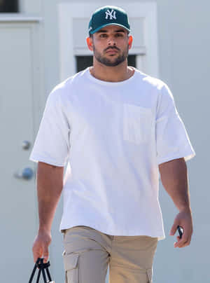 Manin Casual Attireand Baseball Cap Wallpaper