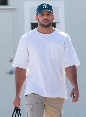 Manin Casual Attireand Baseball Cap Wallpaper