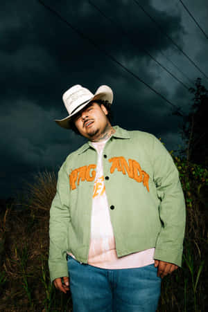 Manin Cowboy Hat Against Stormy Sky Wallpaper