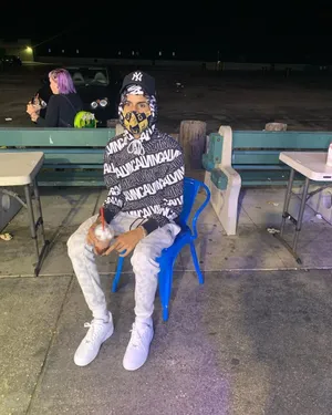 Manin Designer Clothingat Night Wallpaper