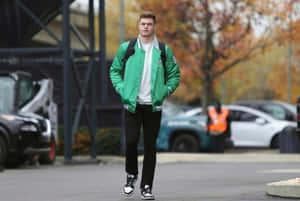 Manin Green Jacket Walking Outdoors Wallpaper