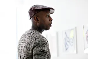 Manin Hat Looking Away Wallpaper