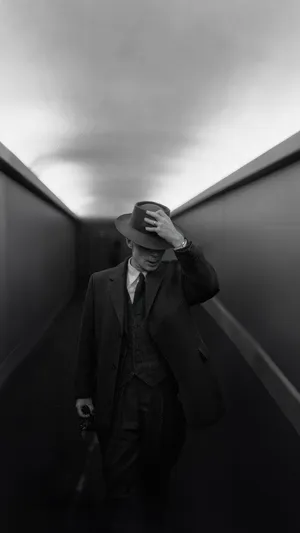 Manin Hat Walking Down Corridor Wallpaper