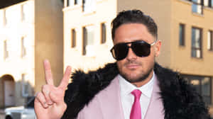 Manin Pink Suit Peace Sign Wallpaper