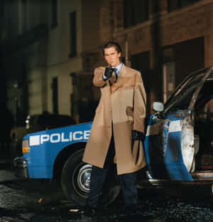 Manin Trench Coat Near Police Car Wallpaper