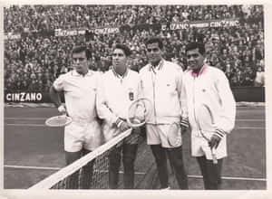 Manuel Santana And Other Players Taking A Photo Wallpaper