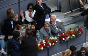 Manuel Santana Sitting On The Bleachers With Acquaintances Wallpaper