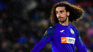 Marc Cucurella Showing Off His Royal Blue Hair On The Field Wallpaper