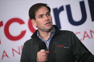 Marco Rubio Holding A Microphone Wallpaper