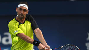 Marcos Baghdatis Intensely Gripping His Tennis Racket Wallpaper