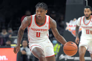 Marcus Sasser In Action On The Basketball Court Wallpaper