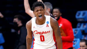 Marcus Sasser In Action On The Basketball Court Wallpaper