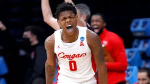 Marcus Sasser In Action On The Basketball Court Wallpaper