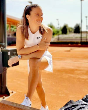 Maria Sakkari Smiling In White Tennis Dress Wallpaper