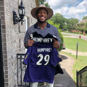 Marlon Humphrey Holding Football Jersey Wallpaper