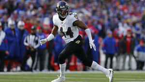Marlon Humphrey In Action Baltimore Ravens Wallpaper