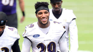 Marlon Humphrey Smilingin Ravens Uniform Wallpaper