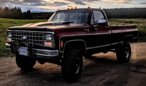 Maroon Jacked Up Trucks Wallpaper