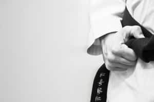 Martial Artist Demonstrating Technique In Pristine Uniform Wallpaper