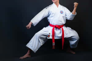 Martial Arts Practitioner In Traditional White Uniform Wallpaper