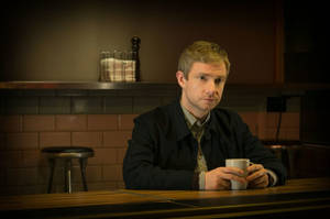 Martin Freeman Holding Cup Wallpaper