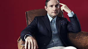 Martin Freeman Sitting On Chair Wallpaper