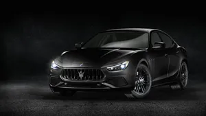 Maserati Ghibli On Scenic Road Wallpaper