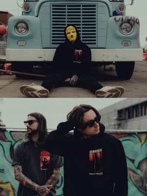 Masked Figureand Tattooed Men Bad Omens Wallpaper