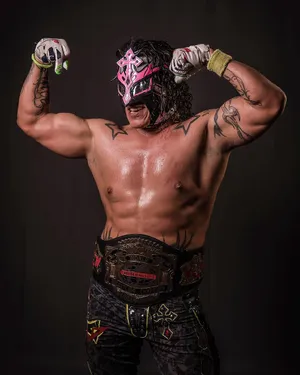 Masked Wrestlerwith Championship Belt Wallpaper