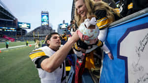 Mason Rudolph Signing Autographfor Fan Wallpaper