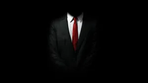 Master Assassin Agent 47 In Hitman Black Wallpaper