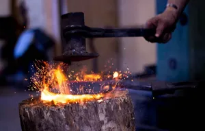 Master Blacksmith Crafting A Forge Wallpaper