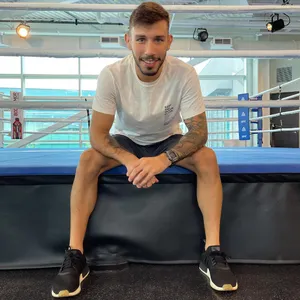 Matheus Nicolau On Edge Of Boxing Ring Wallpaper