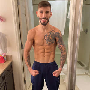 Matheus Nicolau Showing Off Muscles Wallpaper