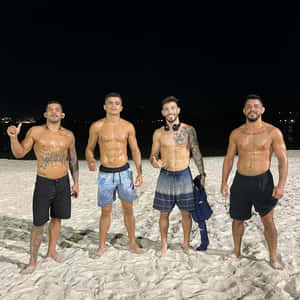 Matheus Nicolau With Friends At Beach Wallpaper