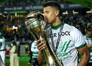 Matheus Nunes Kissing A Trophy Wallpaper