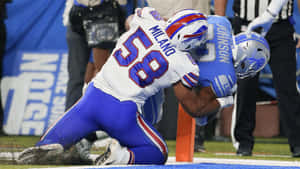 Matt Milano Tackling Opponent During Game Wallpaper