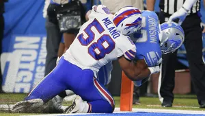 Matt Milano Tackling Opponent During Game Wallpaper