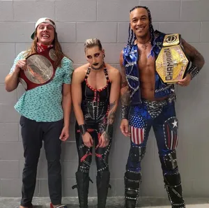 Matt Riddle With Rhea And Damian Wallpaper