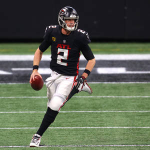 Matt Ryan Running And Holding A Ball Wallpaper