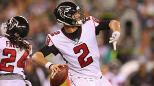 Matt Ryan Throwing A Ball In White Jersey Wallpaper