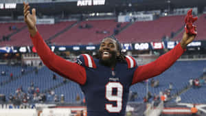 Matthew Judon Celebrating Victoryat Stadium Wallpaper