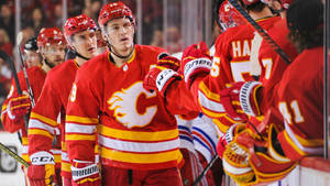 Matthew Tkachuk With Teammates Pre-game Fist Bump Wallpaper