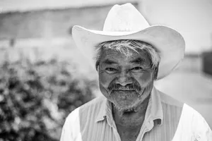 Mature Man Wearing A Cowboy Hat Wallpaper