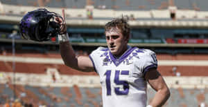 Max Duggan Football Player Helmet Raise Wallpaper