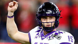 Max Duggan T C U Quarterback Raising Fist Wallpaper