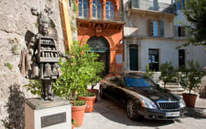 Maybach Landaulet Near Historic Building Wallpaper