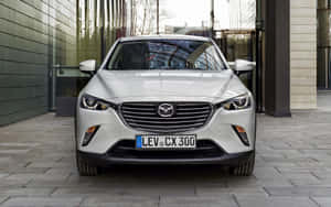 Mazda C X3 Front View Urban Setting Wallpaper